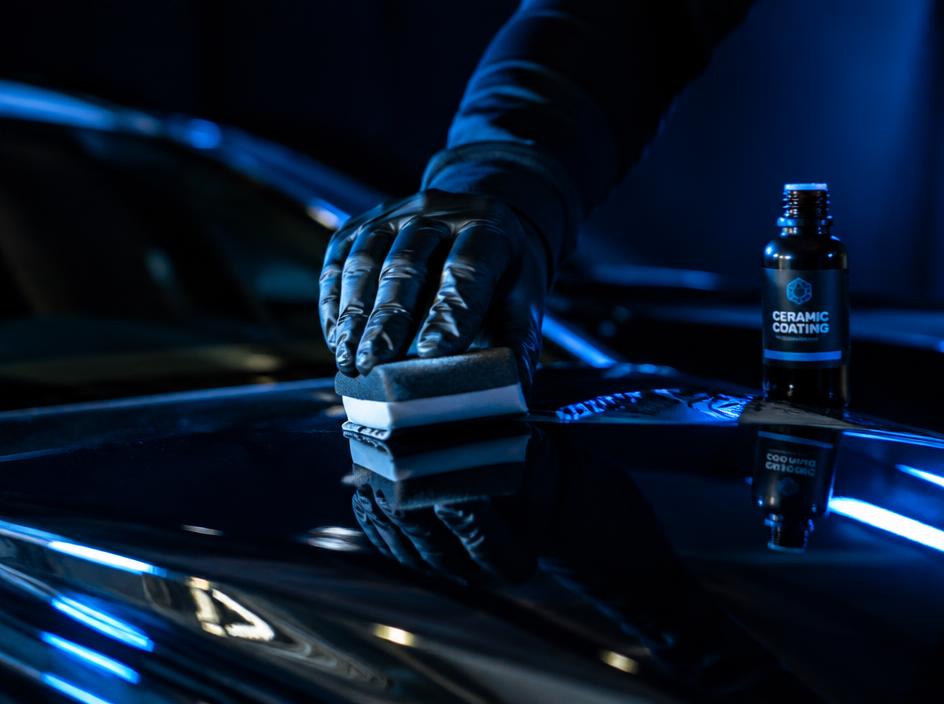 Ceramic coating being applied to a glossy car hood